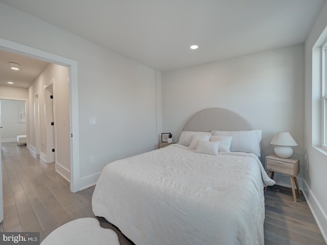 bedroom with hardwood / wood-style floors