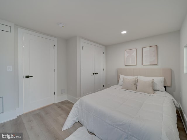 bedroom with light hardwood / wood-style flooring