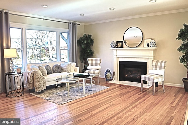 living room with hardwood / wood-style flooring and ornamental molding