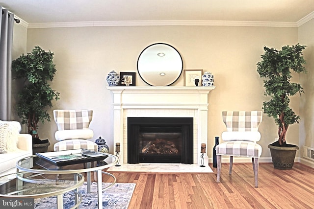 living room with ornamental molding and hardwood / wood-style floors