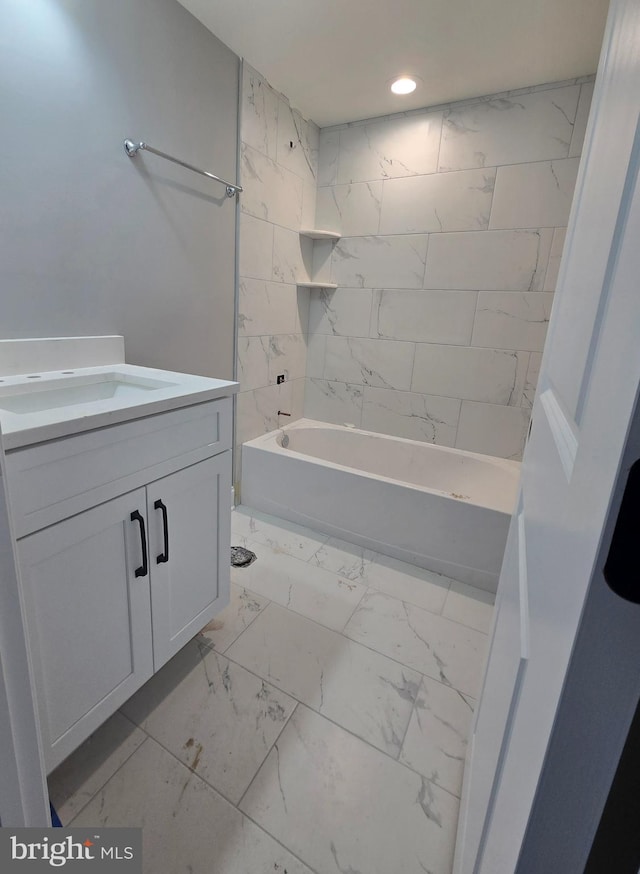 full bathroom with recessed lighting, marble finish floor, shower / bath combination, and vanity