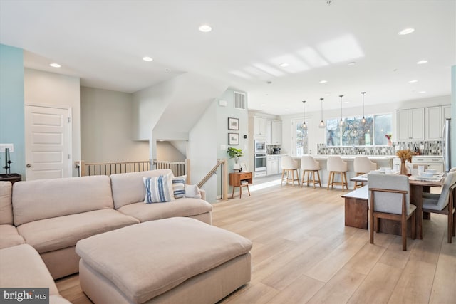 living room featuring light wood-type flooring