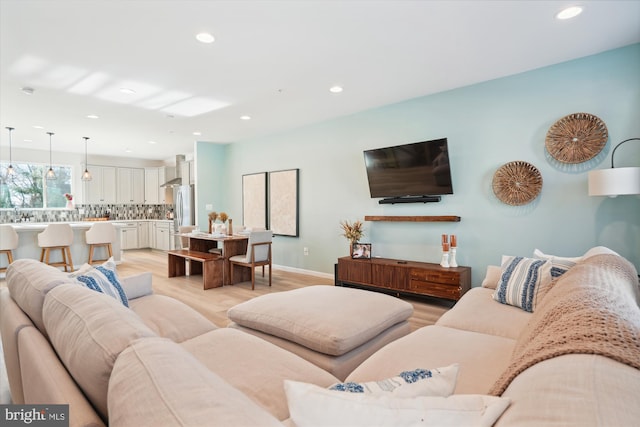 living room with light hardwood / wood-style flooring