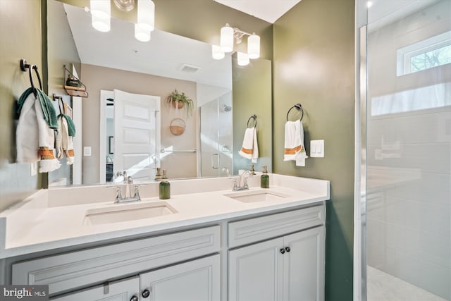 bathroom with vanity and walk in shower