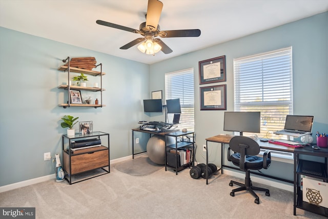 home office with ceiling fan and light colored carpet