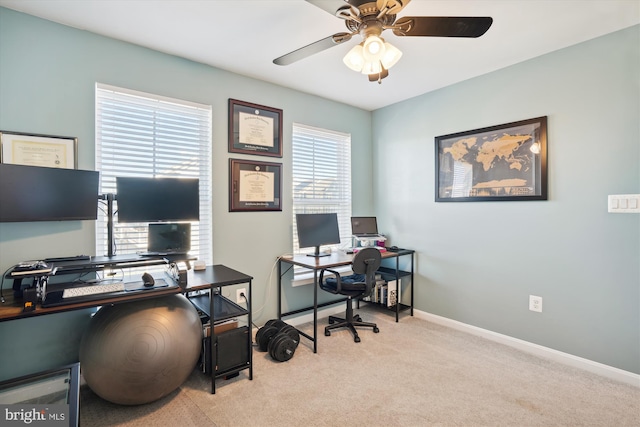 office space with light colored carpet and ceiling fan