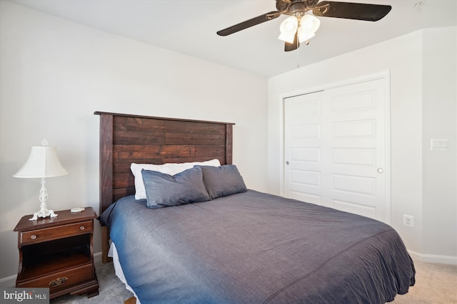 bedroom with carpet, a closet, and ceiling fan