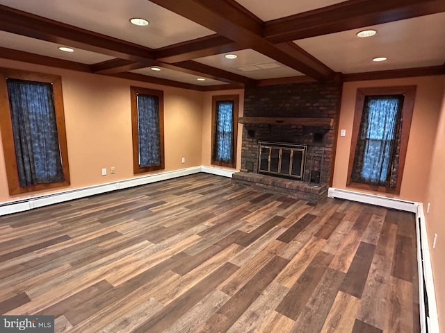 unfurnished living room featuring a fireplace, baseboard heating, wood finished floors, beamed ceiling, and baseboards