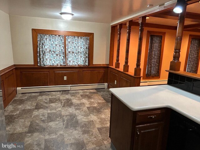 interior space featuring wainscoting and baseboard heating