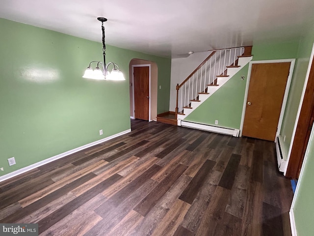 unfurnished dining area with a baseboard radiator, wood finished floors, baseboards, stairs, and an inviting chandelier