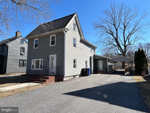 view of home's exterior with driveway