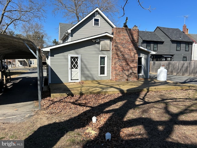 rear view of property with fence