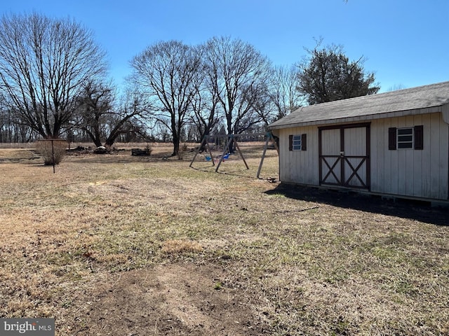 view of yard with an outbuilding and a storage shed