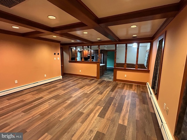 interior space with a baseboard radiator, visible vents, dark wood-style flooring, and beamed ceiling