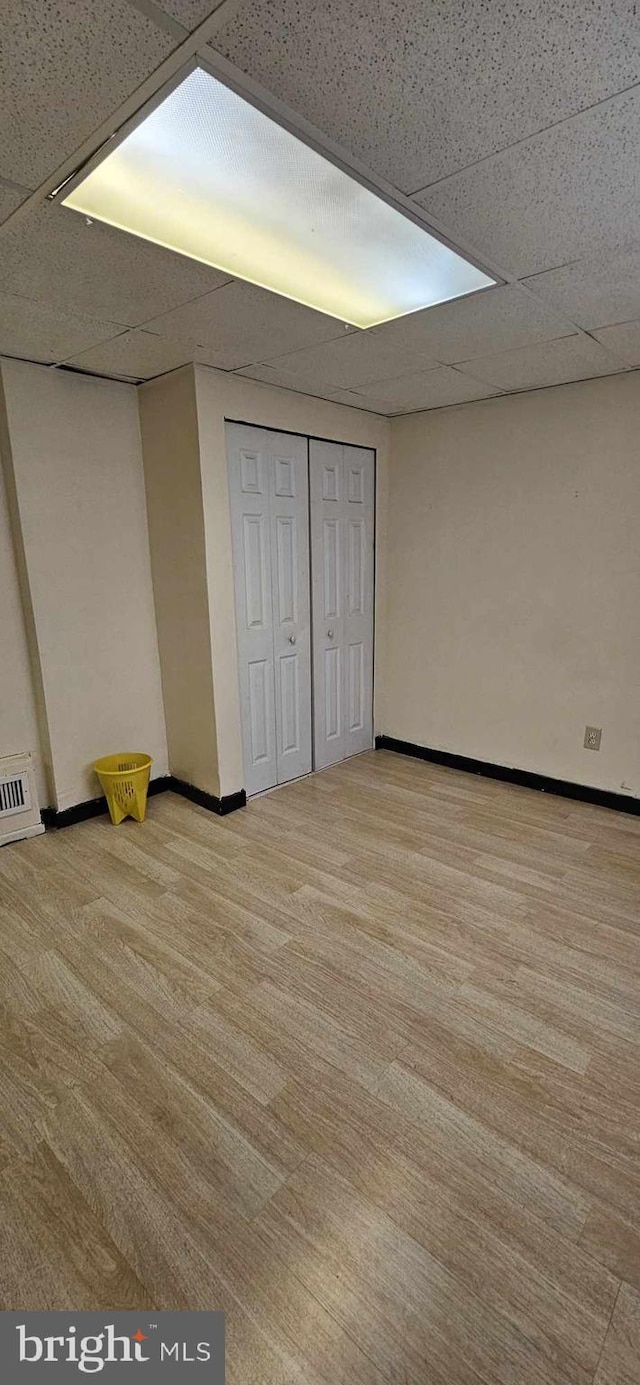 unfurnished bedroom with a paneled ceiling