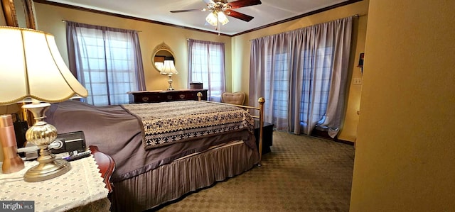 carpeted bedroom featuring ceiling fan and crown molding