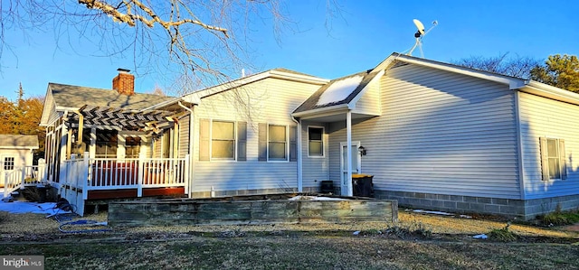 view of side of property featuring a chimney