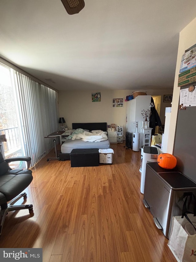 bedroom with wood-type flooring