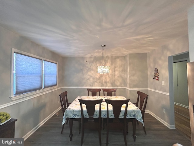 dining room with dark hardwood / wood-style floors