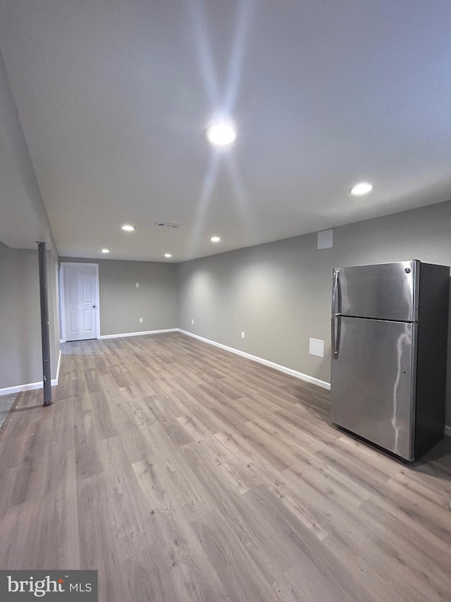 unfurnished living room with light wood-type flooring