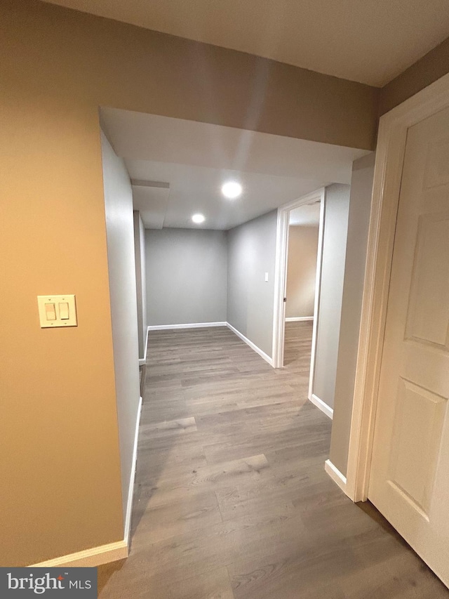 basement featuring light hardwood / wood-style flooring