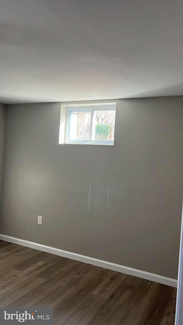 basement with dark wood-type flooring