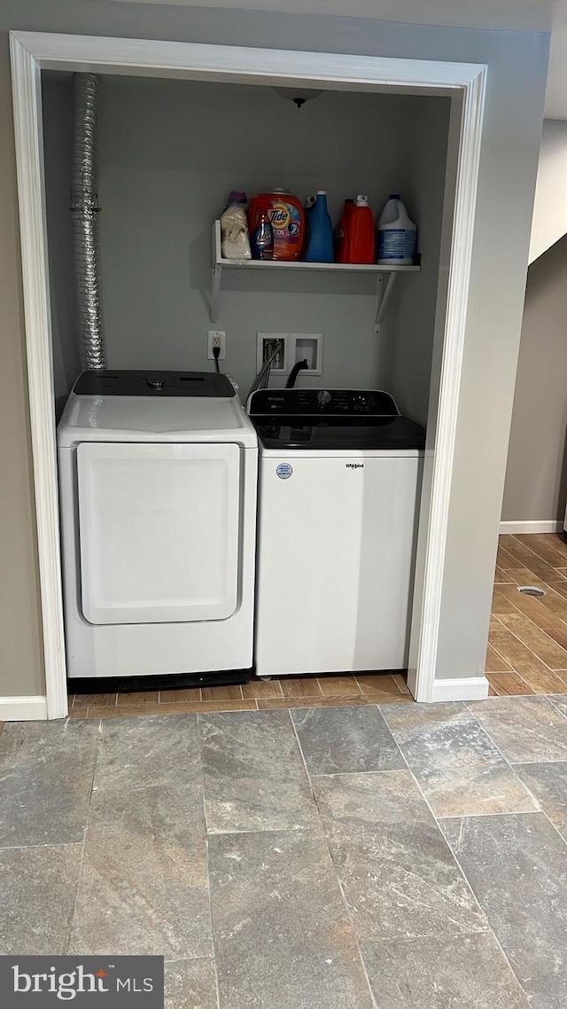 laundry room featuring washing machine and clothes dryer