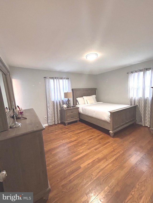 unfurnished bedroom featuring dark wood-type flooring