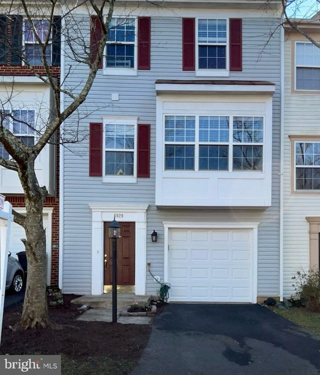 multi unit property featuring a garage