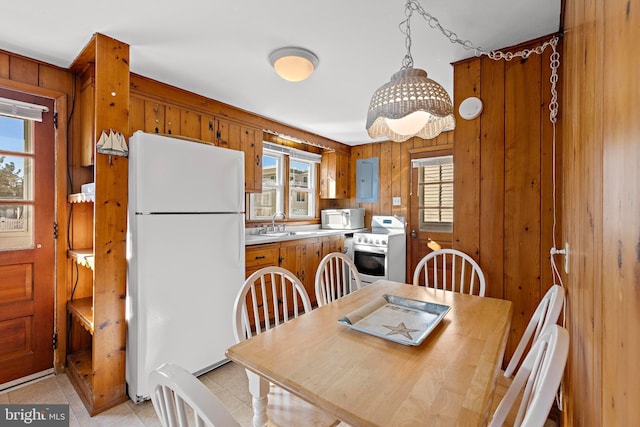 tiled dining space with wooden walls