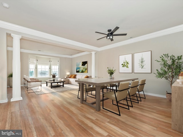 dining room featuring decorative columns, ceiling fan, ornamental molding, and light hardwood / wood-style floors