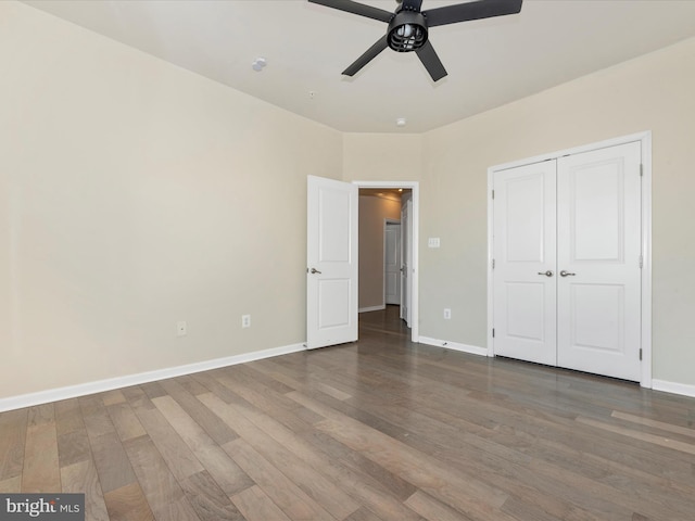 unfurnished bedroom featuring a closet, ceiling fan, and hardwood / wood-style flooring