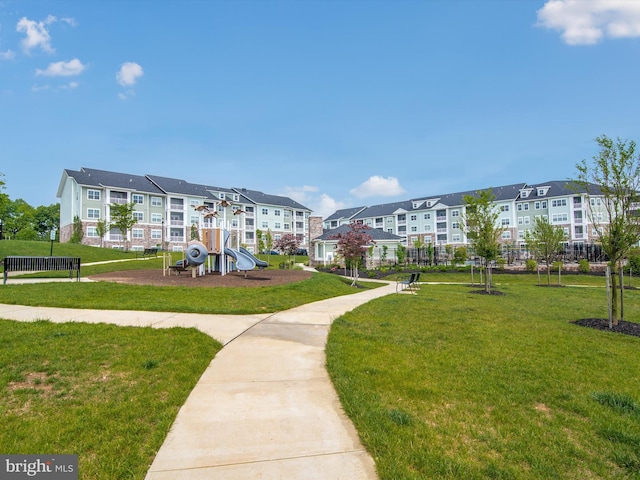 surrounding community with a playground and a yard