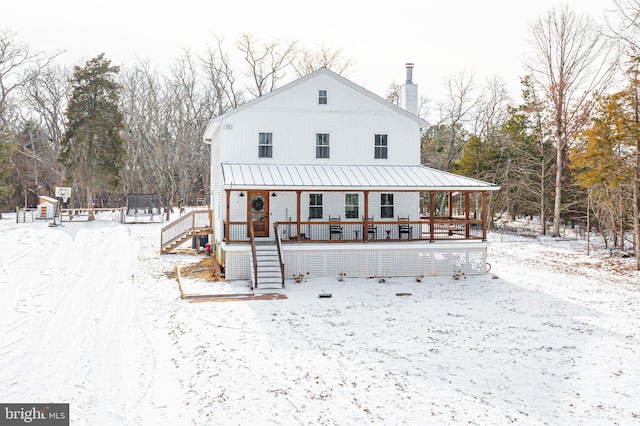 view of front facade featuring covered porch and a trampoline