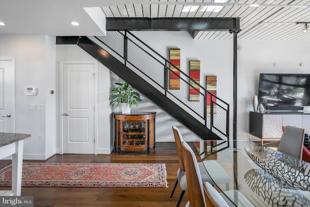 stairway with hardwood / wood-style flooring