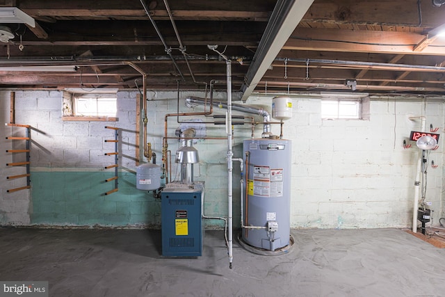 utility room featuring water heater