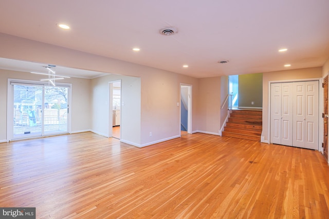 unfurnished room with crown molding and light wood-type flooring