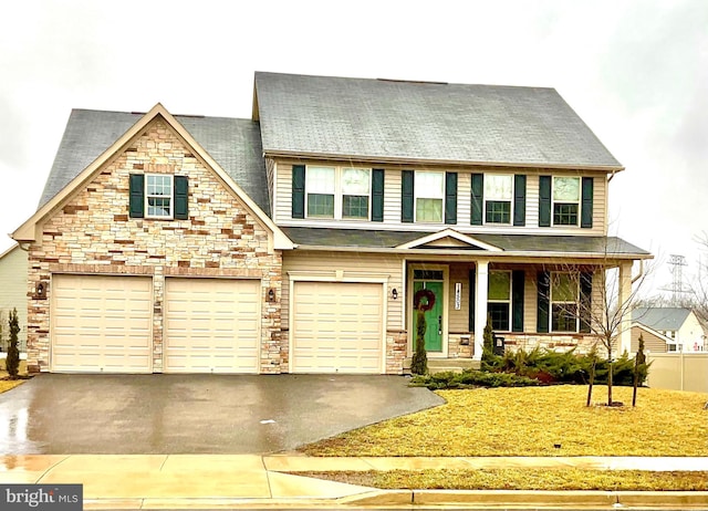 view of front of home with a porch and a garage