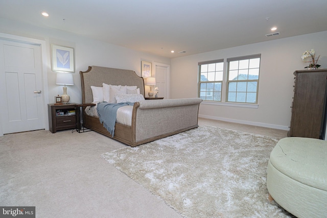 bedroom with light colored carpet