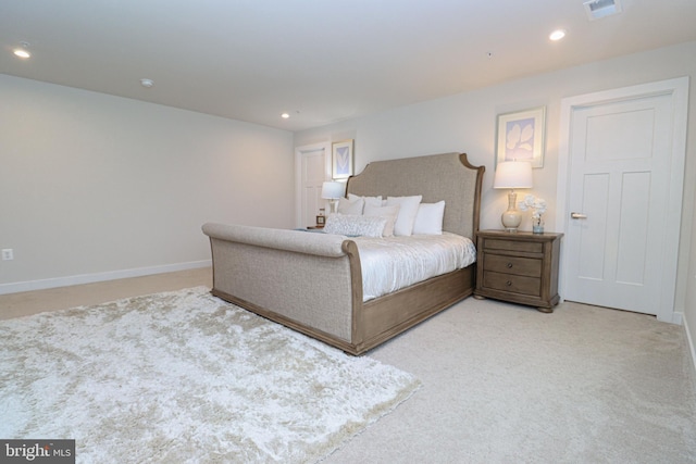 bedroom with light colored carpet