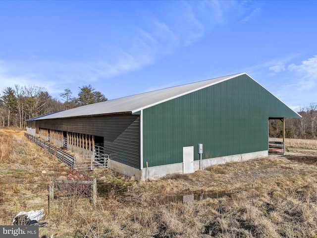 view of property exterior featuring an outbuilding and an outdoor structure