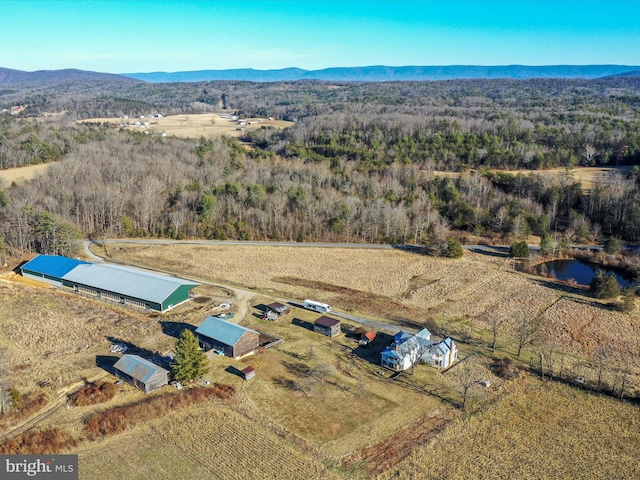 bird's eye view with a mountain view and a view of trees