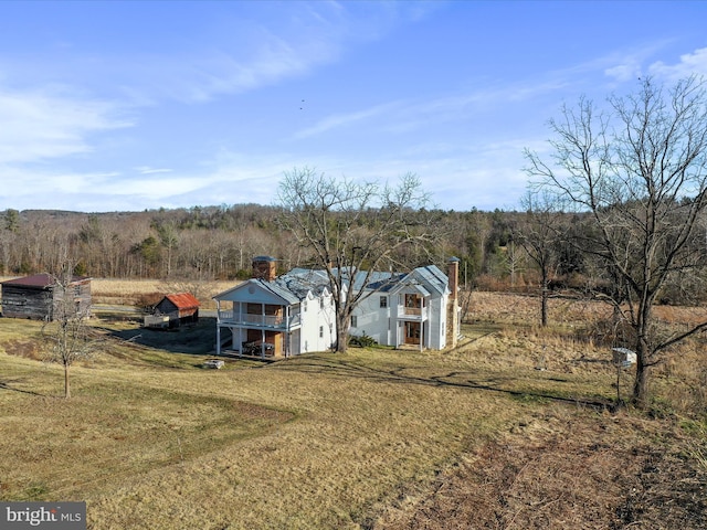 exterior space with a view of trees