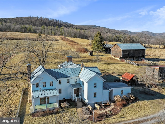 drone / aerial view featuring a mountain view and a rural view