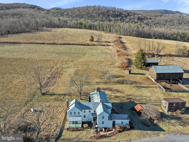 bird's eye view featuring a forest view, a rural view, and a mountain view