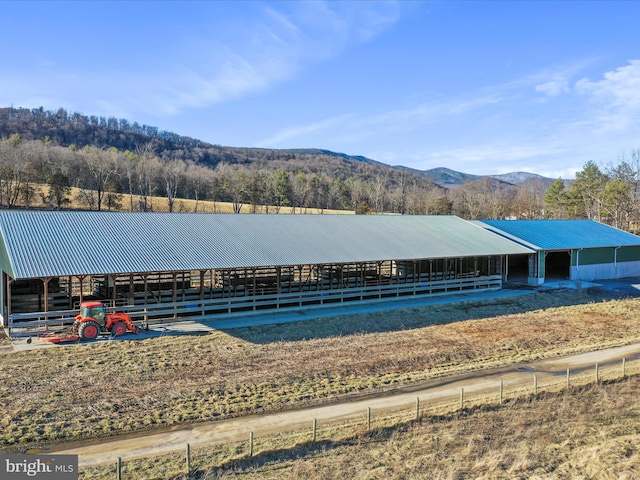 exterior space featuring a mountain view and an outbuilding