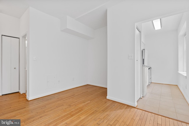 spare room featuring light wood-type flooring