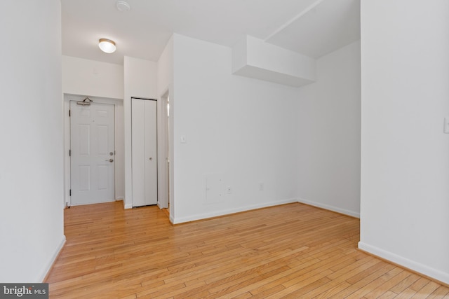 spare room featuring light hardwood / wood-style flooring