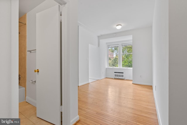 hall with light hardwood / wood-style flooring