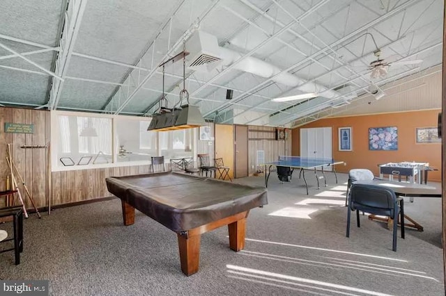 rec room featuring carpet, ceiling fan, wooden walls, and pool table